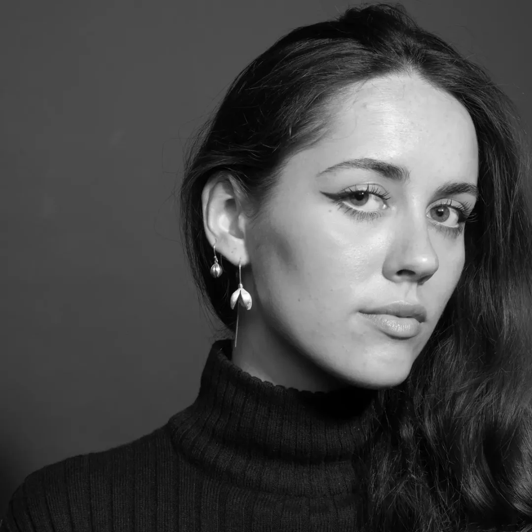 Woman wearing elegant snowdrop earrings